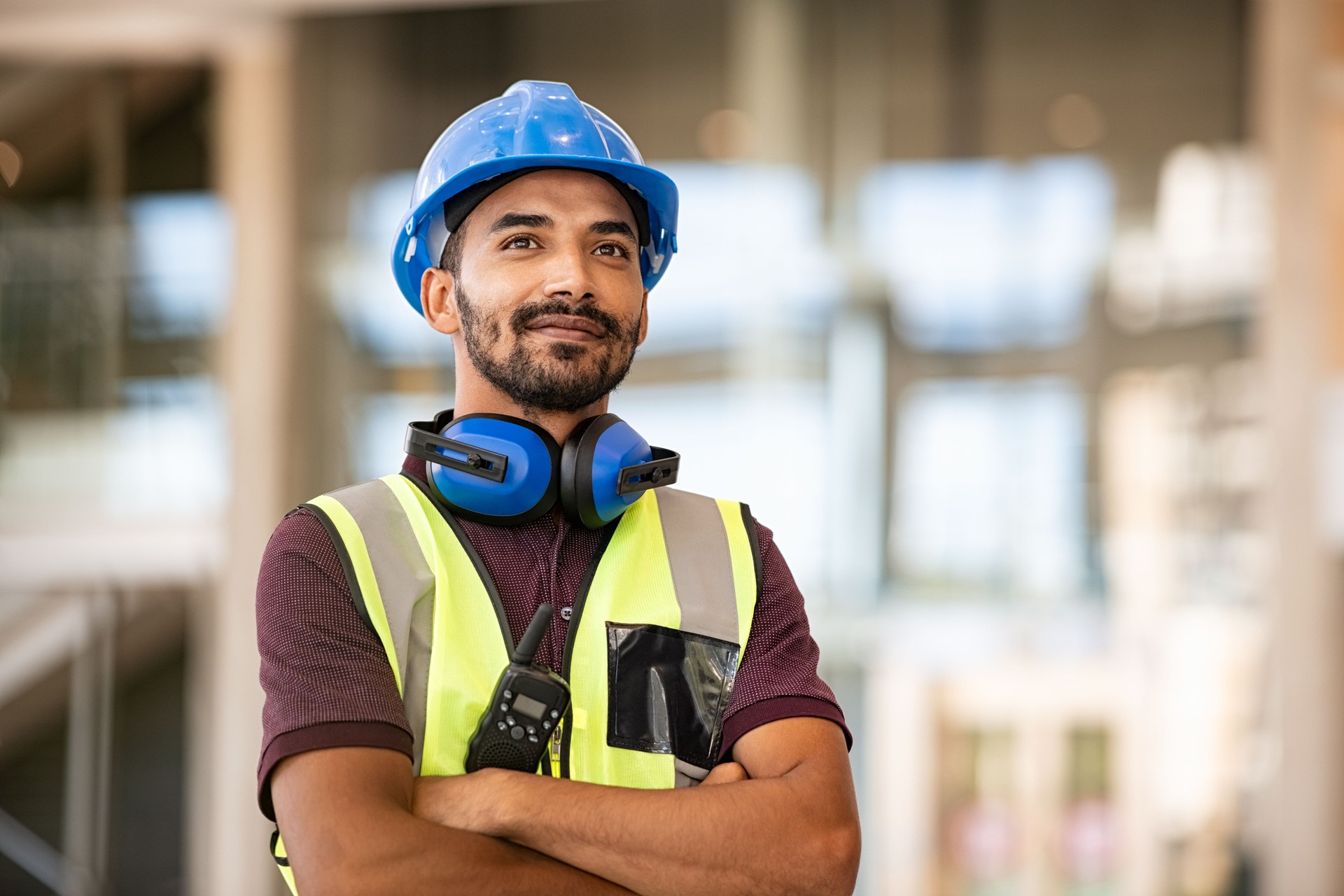 Successful construction site worker thinking